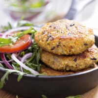 Vegan quinoa and wild rice burger patty on a bun