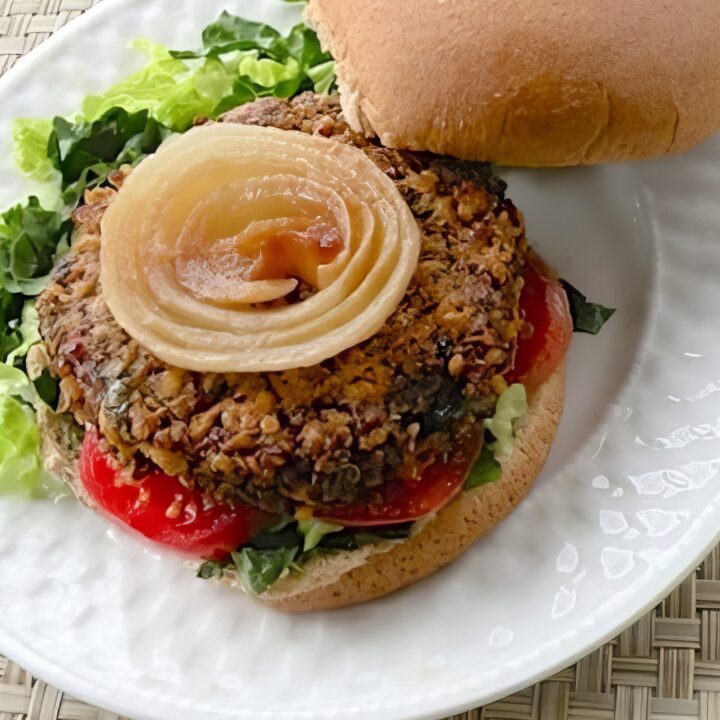 Vegan quinoa mushroom burger on a whole grain bun