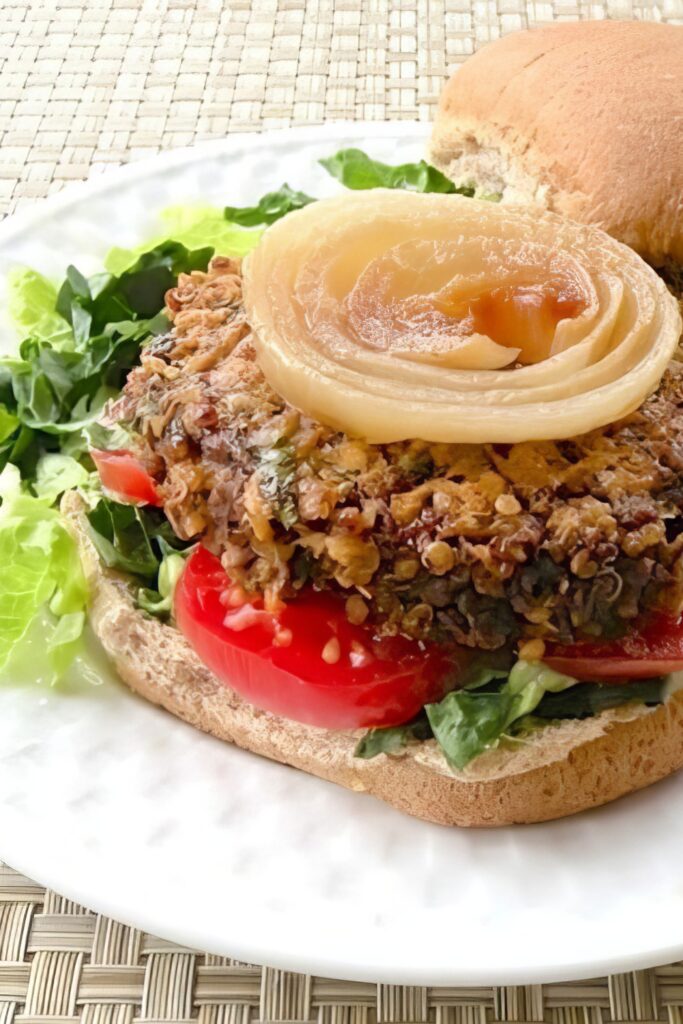 Vegan quinoa lentil mushroom burger patty stacked on a plate
