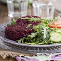 Vegan beet burger patty on a bun with toppings