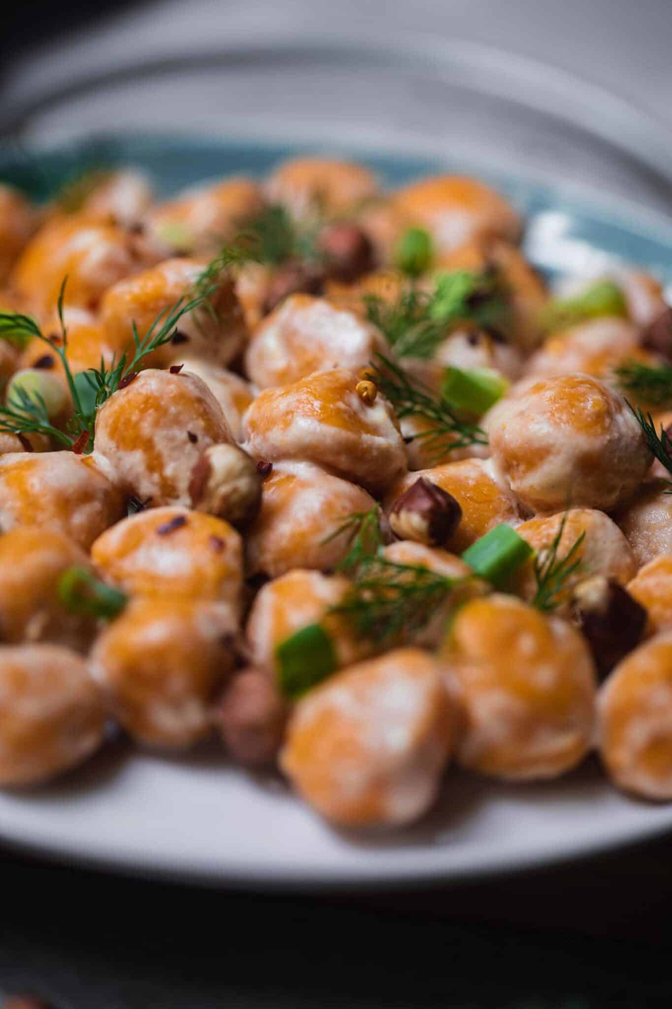 Side view of homemade sweet potato gnocchi on a plate