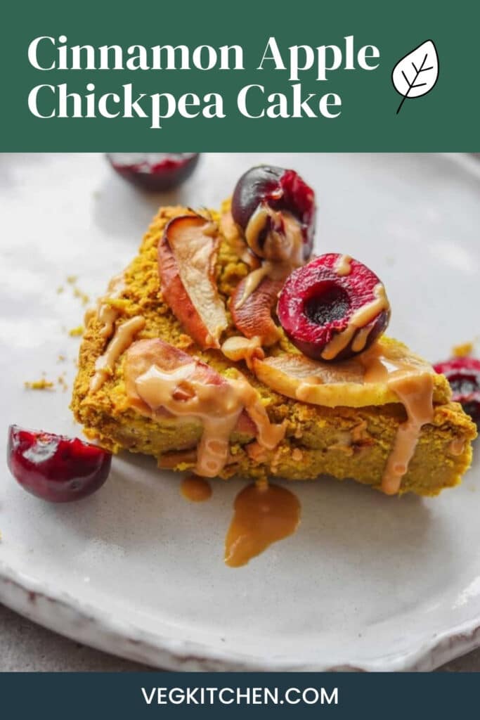 Cinnamon apple chickpea cake Pinterest pin showing a slice with cherries and a nut butter drizzle