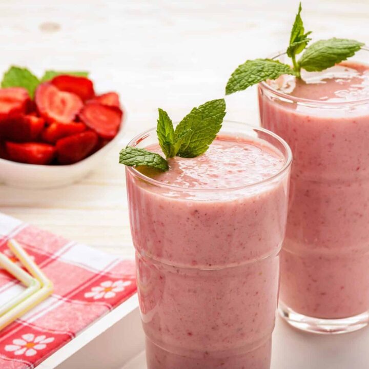 Vegan strawberry vanilla maca smoothie topped with mint