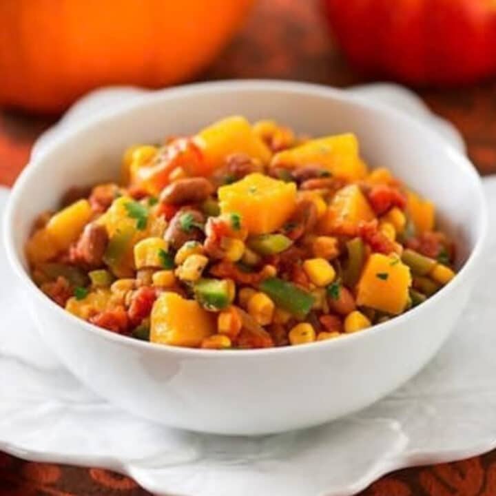 Bowl of vegan Three Sisters Stew with butternut squash, pinto beans and corn