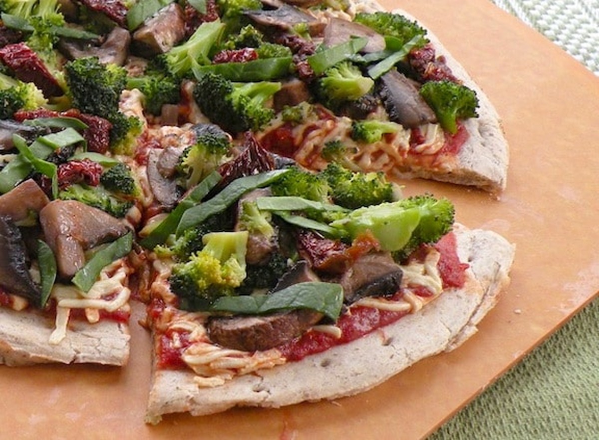 Vegan broccoli, mushroom, and sun-dried tomato pizza