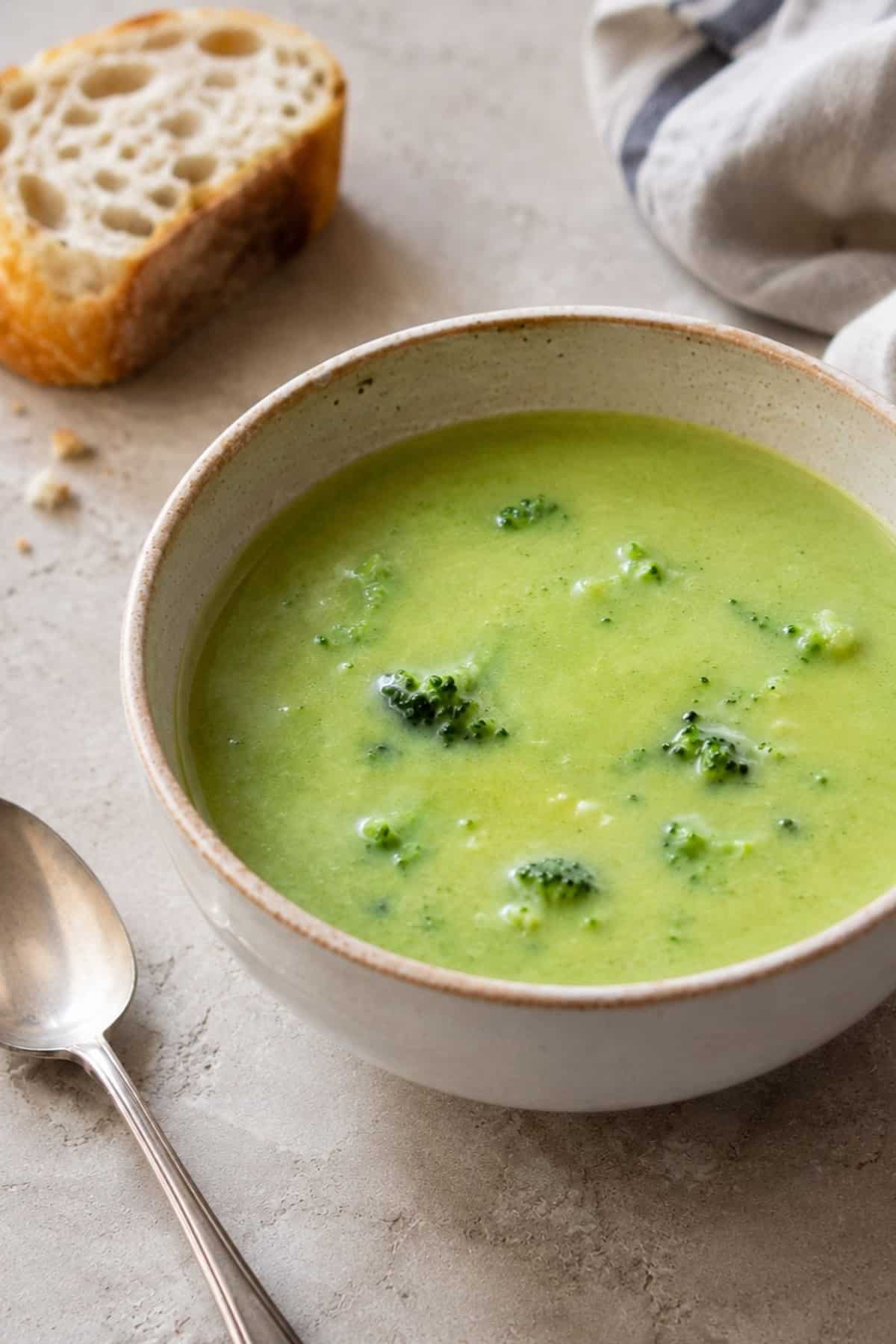 Close-up of vegan cream of broccoli soup with bread